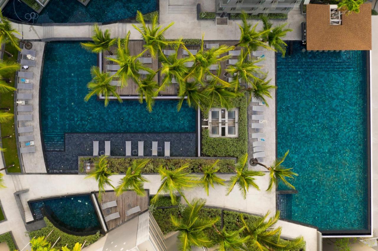Oceanfront Beach Resort - Sha Extra Plus Patong Екстер'єр фото Aerial view of the pool at the hotel