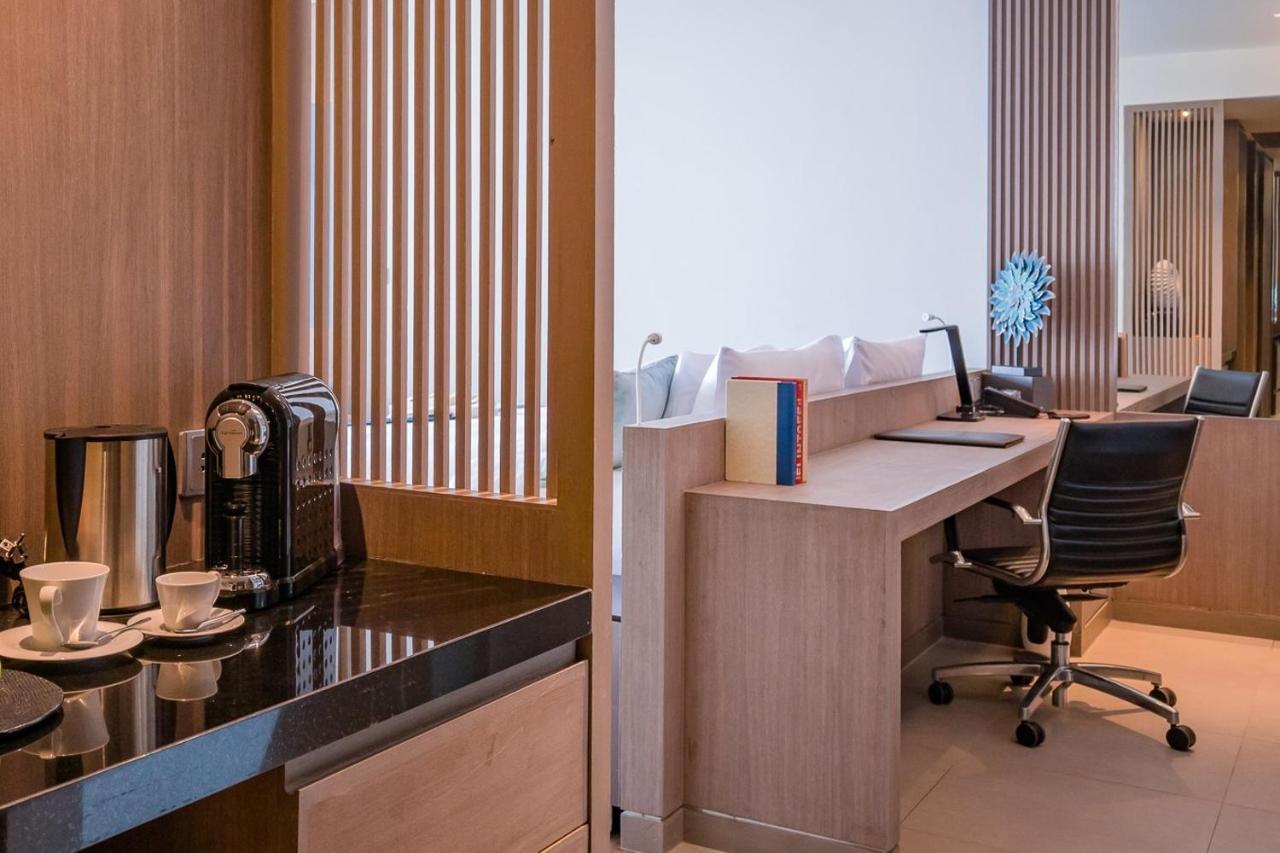 Oceanfront Beach Resort - Sha Extra Plus Patong Екстер'єр фото A suite at the hotel