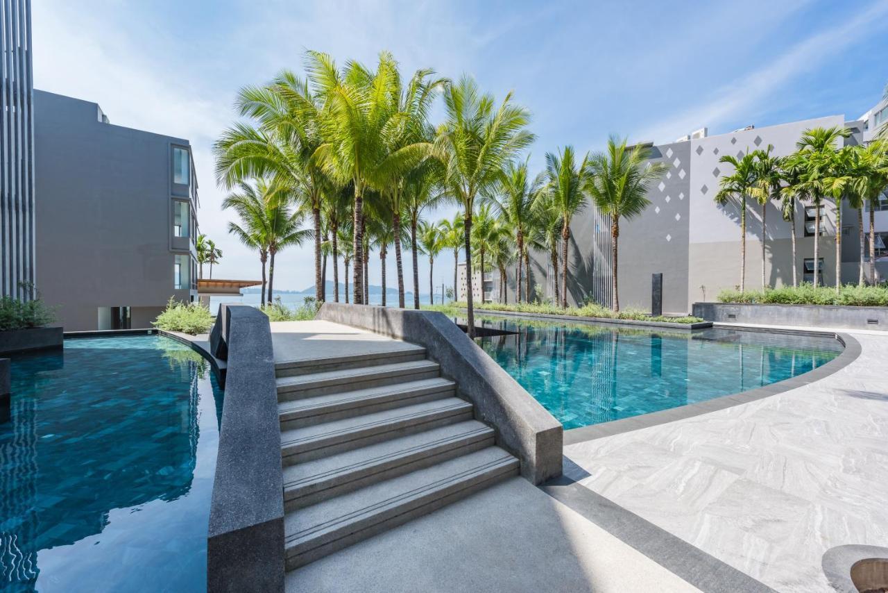 Oceanfront Beach Resort - Sha Extra Plus Patong Екстер'єр фото The swimming pool at the resort